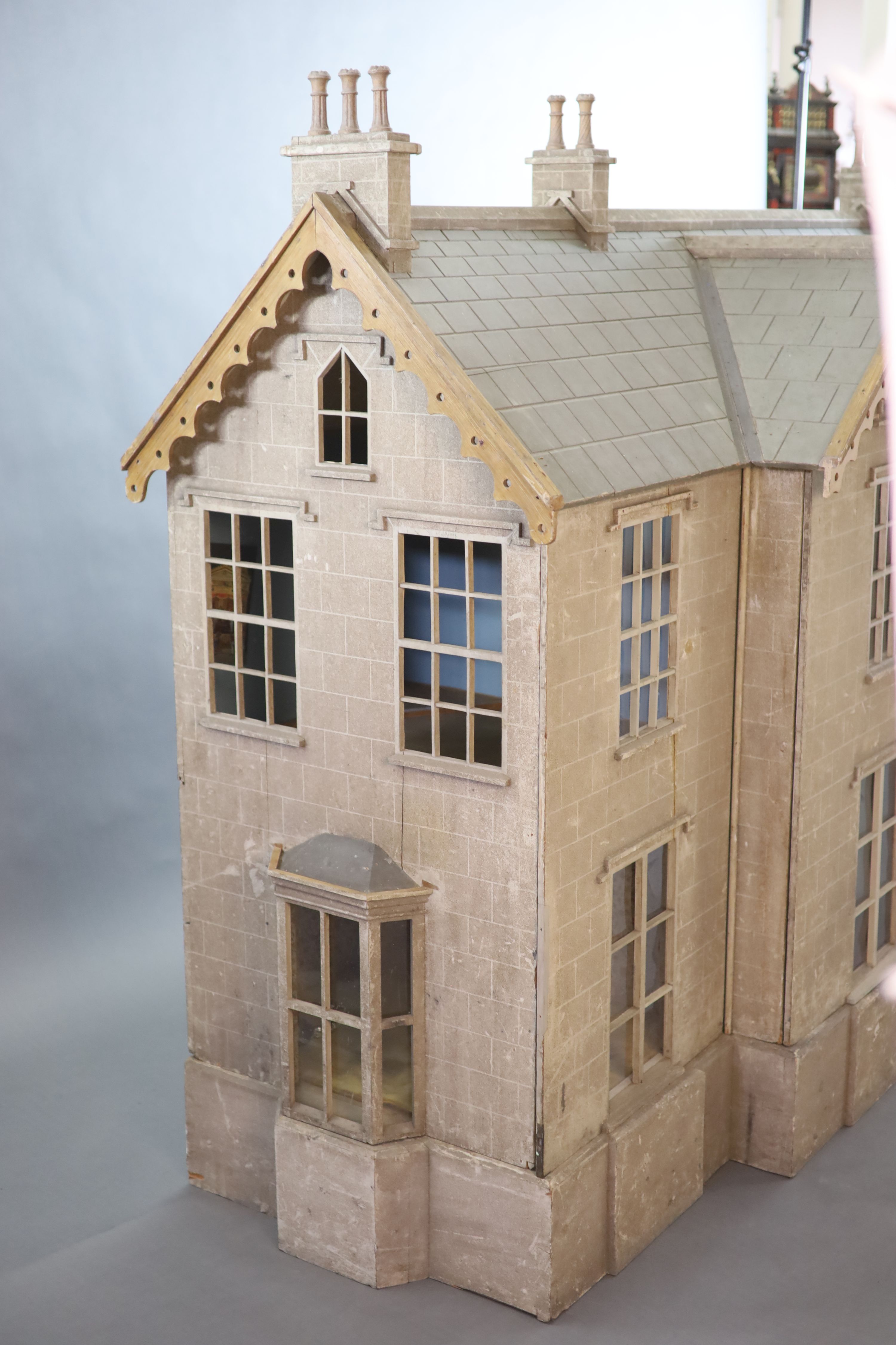 An unusually large painted pine doll's house, modelled upon a Victorian lodge house, Estate Carpenter made, Lake District width 198cm height 156cm